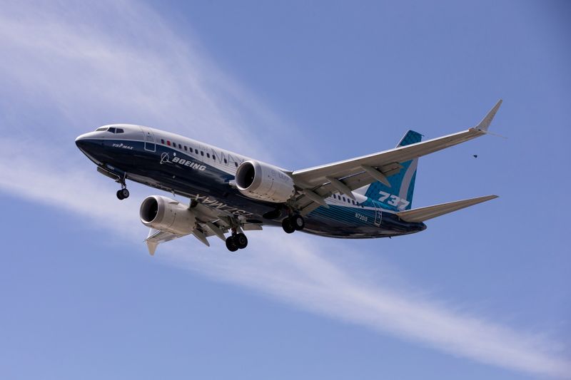 © Reuters. FILE PHOTO: A Boeing 737 MAX airplane lands after a test flight at Boeing Field in Seattle