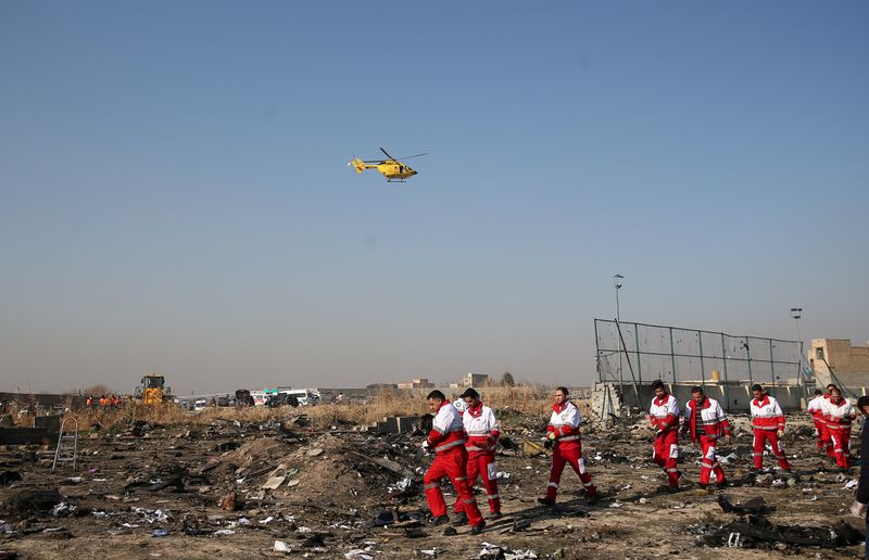 &copy; Reuters. FILE PHOTO: Rescue team works among debris of a plane belonging to Ukraine International Airlines, which crashed after take-off from Iran&apos;s Imam Khomeini airport, on the outskirts of Tehran