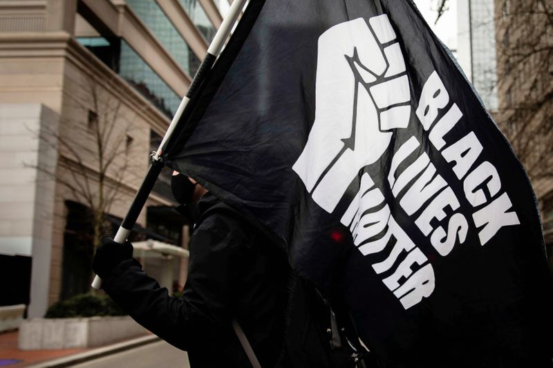 &copy; Reuters. FILE PHOTO: People demonstrate during a march in Portland