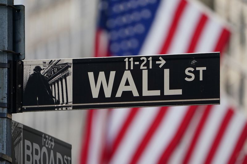 © Reuters. The Wall Street sign is pictured at the New York Stock exchange (NYSE) in the Manhattan borough of New York City