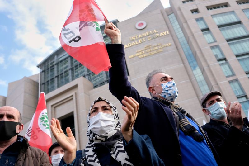 &copy; Reuters. FILE PHOTO: Supporters of jailed Kurdish politician Selahattin Demirtas gather outside the Istanbul Justice Palace