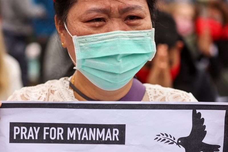 © Reuters. A woman cries during a gathering to denounce the Myanmar military coup, in Taipei