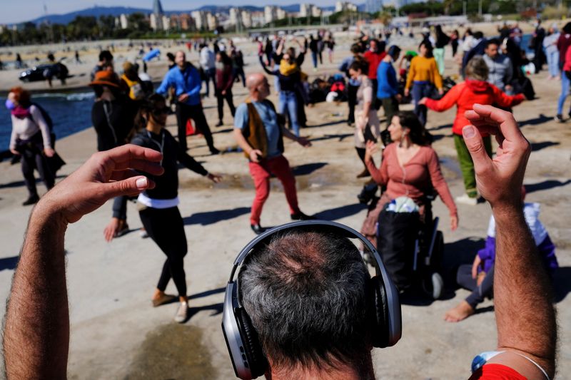 Ravers feel the music at socially distanced silent disco in Barcelona