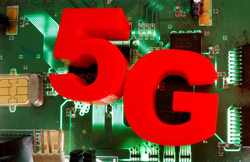 &copy; Reuters. FILE PHOTO: 3d printed objects representing 5G are put on a motherboard in this picture illustration