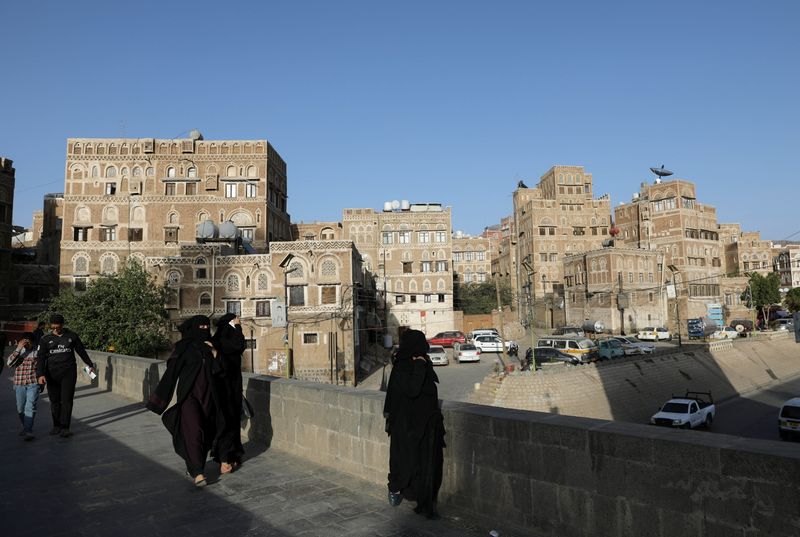 &copy; Reuters. People walk in the old quarter of Sanaa