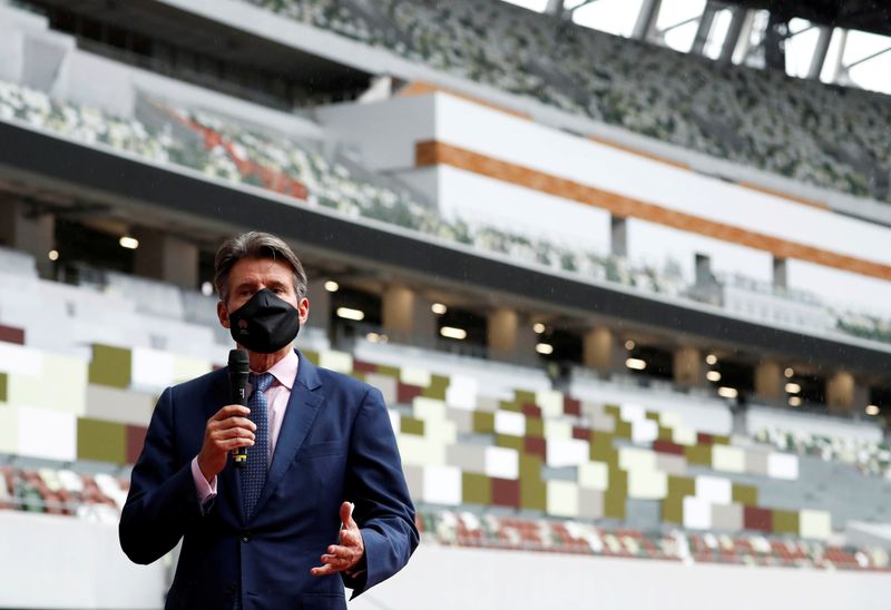 © Reuters. FILE PHOTO: World Athletics President Sebastian Coe wearing a protective face mask speaks to media as he inspects the National Stadium, amid the coronavirus disease (COVID-19) outbreak in Tokyo