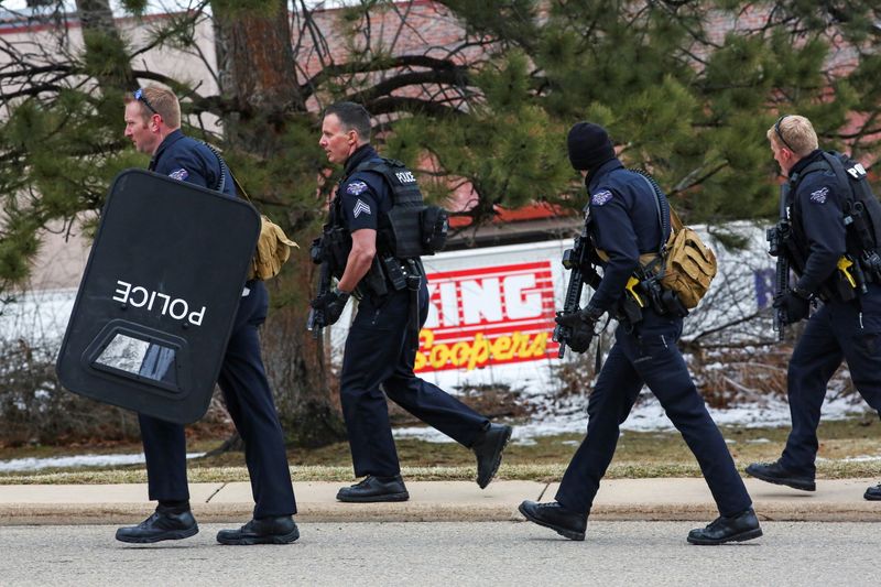 &copy; Reuters. Law enforcement officers stand at the perimeter of a shooting site at King Soopers grocery store in Boulder