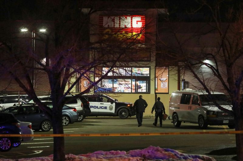 &copy; Reuters. Law enforcement officers investigate the site of a shooting at a King Soopers grocery store in Boulder