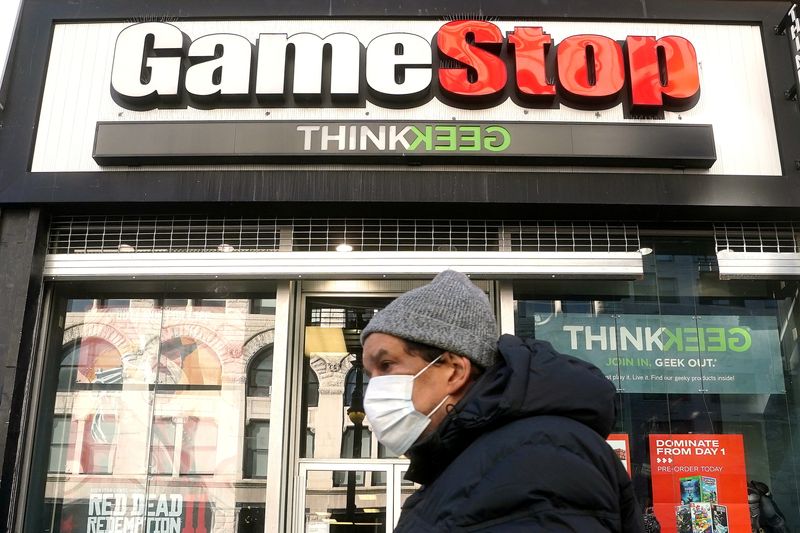 &copy; Reuters. FILE PHOTO: A person walks past a GameStop in New York