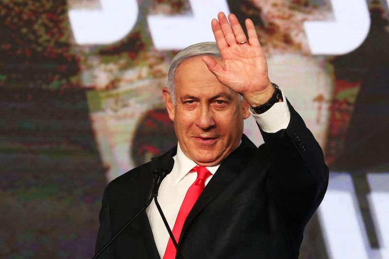 &copy; Reuters. Israeli Prime Minister Benjamin Netanyahu gestures as he delivers a speech to supporters following the announcement of exit polls in Israel&apos;s general election at his Likud party headquarters in Jerusalem