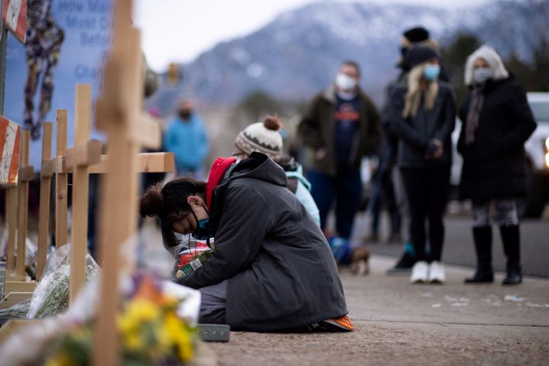 &copy; Reuters. People leave flowers at the site of a mass shooting at King Soopers grocery store in Boulder