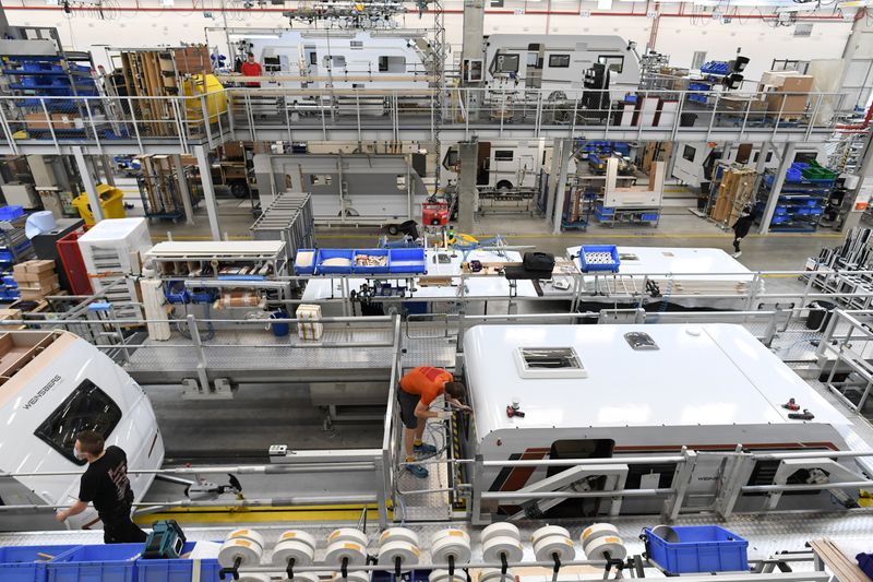 &copy; Reuters. Workers assemble enclosures at the factory of German caravan and trailer maker Knaus-Tabbert AG