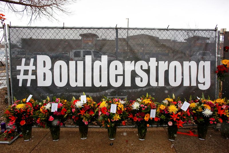 &copy; Reuters. People leave flowers at the site of a mass shooting at King Soopers grocery store in Boulder