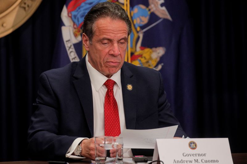 &copy; Reuters. New York Governor Andrew Cuomo reads a note during a news conference at his offices in New York