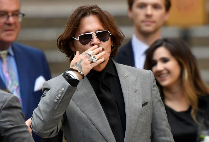 © Reuters. FILE PHOTO: Actors Johnny Depp and Amber Heard at the High Court in London