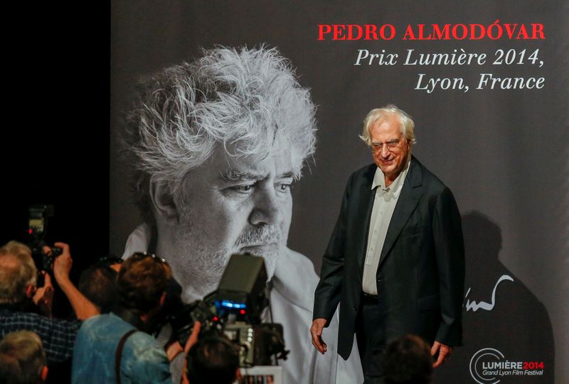 © Reuters. FILE PHOTO: Director Tavernier poses for photographers as he arrives at the 2014 Lumiere Film Festival prize in Lyon