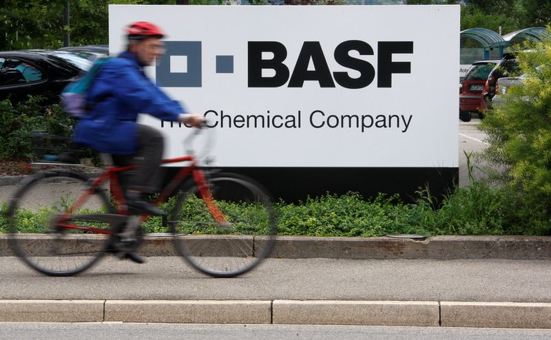 &copy; Reuters. FILE PHOTO: A cyclist rides his bike bast the entrance of a BASF plant in Schweizerhalle, Switzerland