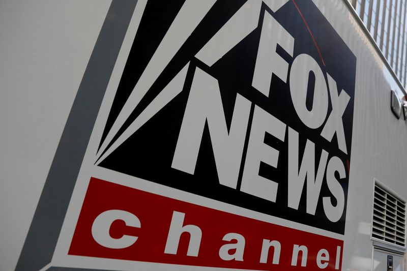 &copy; Reuters. FILE PHOTO: FILE PHOTO: A Fox News channel sign is seen on a television vehicle outside the News Corporation building in New York City, in New York