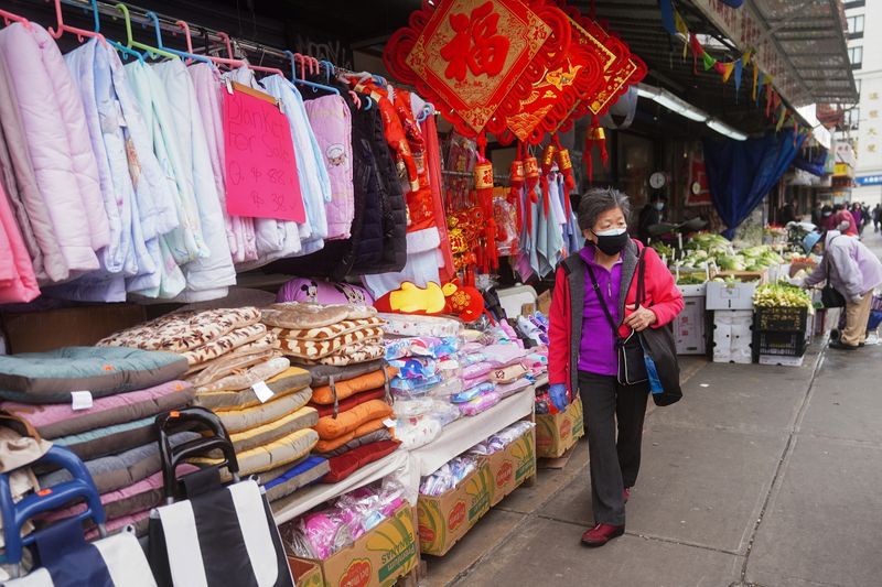 &copy; Reuters. A woman shops in Chinatown in New York City