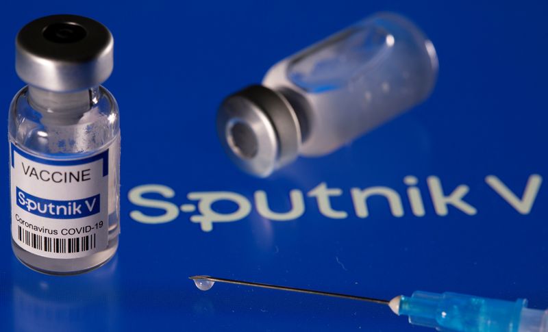 &copy; Reuters. Fiala etichettata &quot;Sputnik V coronavirus disease (COVID-19) vaccine&quot; sul logo Sputnik V