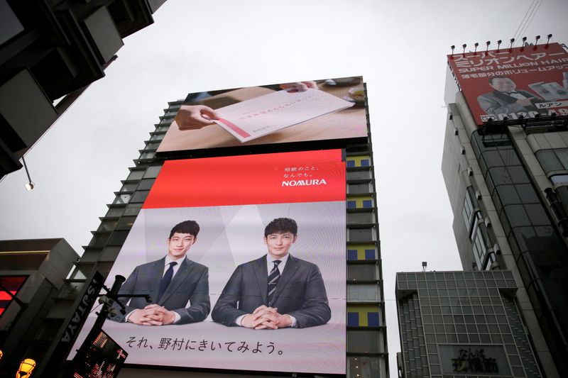 © Reuters. A Nomura commercial is shown on a television screen in Osaka