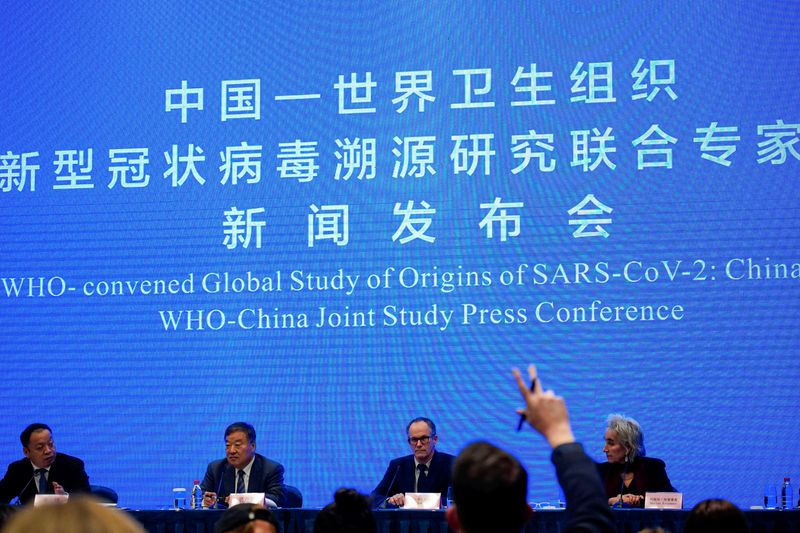 &copy; Reuters. FILE PHOTO: WHO team at a news conference in Wuhan