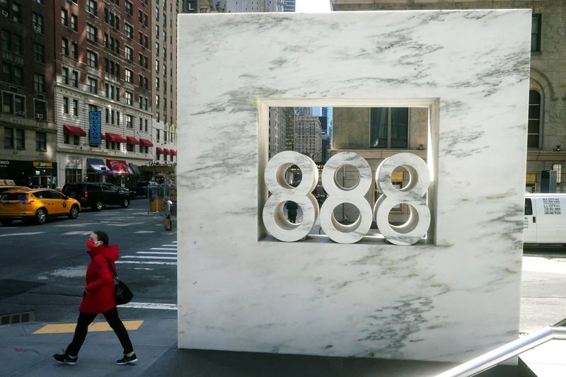 © Reuters. FILE PHOTO: A person walks past 888 7th Ave, a building that reportedly houses Archegos Capital in New York City