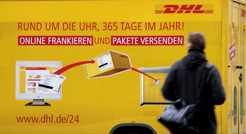 &copy; Reuters. FILE PHOTO: A man passes a DHL truck in Berlin, Germany