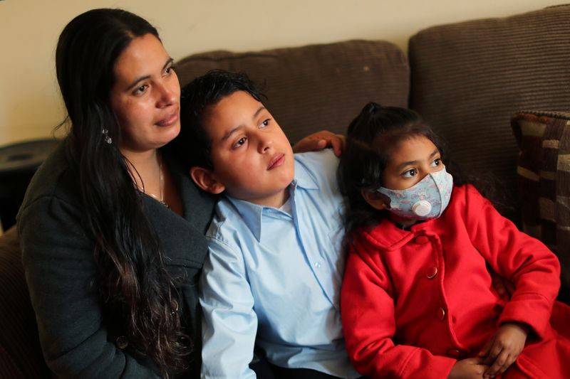 &copy; Reuters. Emiliana, 32, poses for a photo with her son, Leonardo, 10, and daughter, Emily, 5, at their apartment in Los Angeles