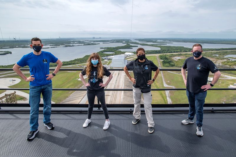 &copy; Reuters. Jared Isaacman, Hayley Arceneaux, Sian Proctor and Chris Sembroski pose for a photo at the SpaceX launch tower at NASA&apos;s Kennedy Space Center at Cape Canaveral