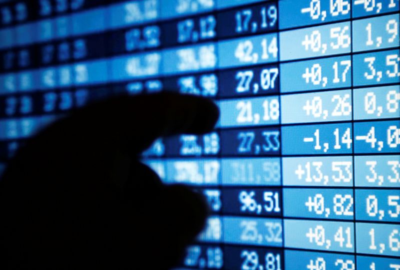 &copy; Reuters. FILE PHOTO: A man points a computer screen showing stock information in this illustration photo taken in Bordeaux