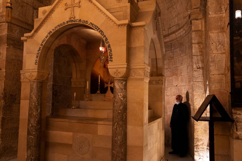 © Reuters. Father Samuel Aghoyan, the Armenian superior at the Church of the Holy Sepulchre stands at the Saint Helena chapel inside the church, during his interview with Reuters, in Jerusalem's Old City