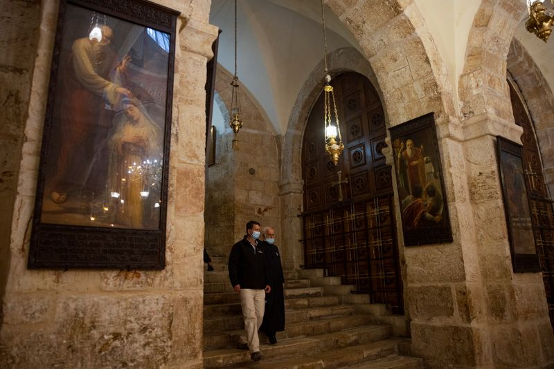 &copy; Reuters. Re&apos;em, Jerusalem regional archaeologist for Israel Antiquities Authority and Father Aghoyan, Armenian superior at Church of the Holy Sepulchre, walk in the Saint Helena chapel inside the church during an interview with Reuters, in Jerusalem&apos;s Ol