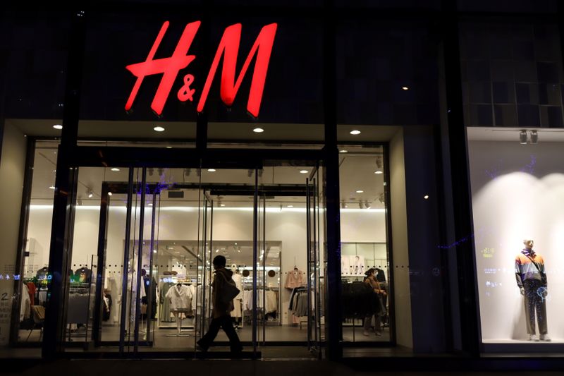 &copy; Reuters. Woman enters an H&amp;M store at a shopping mall in Beijing