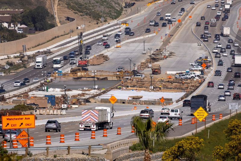 &copy; Reuters. Work crews continue to work on the construction of a freeway overpass in Encinitas