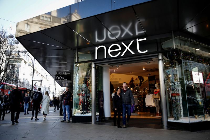 &copy; Reuters. FILE PHOTO: Shoppers walk past a Next store on Oxford Street in London