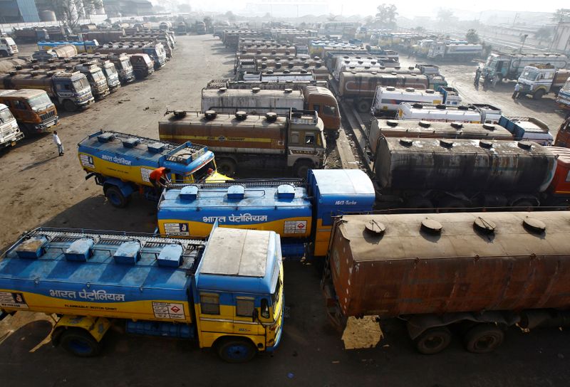 &copy; Reuters. Oil tankers are seen parked at a yard outside a fuel depot on the outskirts of Kolkata