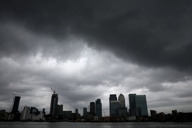 &copy; Reuters. Rain clouds pass over Canary Wharf financial financial district in London