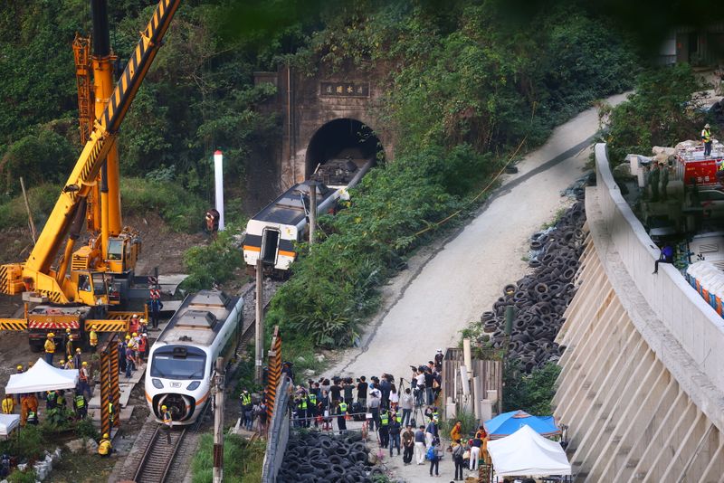 &copy; Reuters. Rescuers work at the site a day after a deadly train derailment at a tunnel north of Hualien, Taiwan