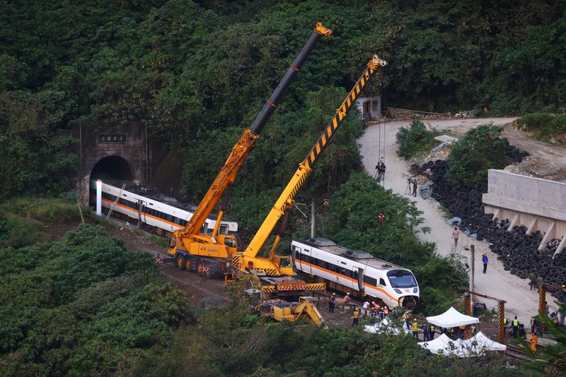 &copy; Reuters. Rescuers work at the site a day after a deadly train derailment at a tunnel north of Hualien, Taiwan