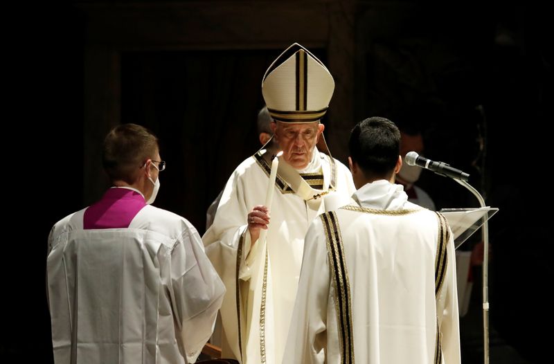 &copy; Reuters. Pope Francis celebrates the Easter Vigil in a near empty St. Peter&apos;s Basilica, at the Vatican