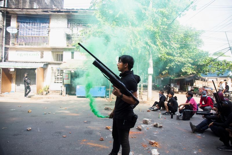 &copy; Reuters. A protester holds a homemade pipe air gun during a protest against the military coup in Yangon