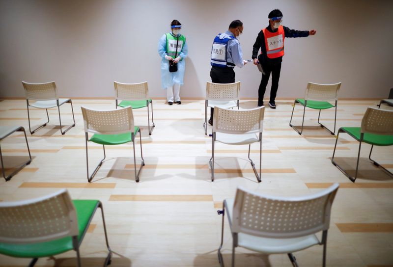 &copy; Reuters. Mock inoculation exercise for coronavirus disease (COVID-19) mass vaccination campaign in Sakura