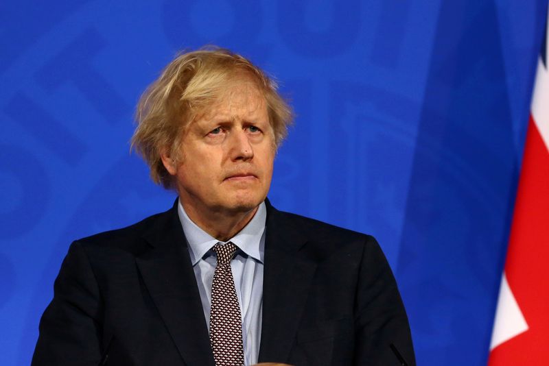 &copy; Reuters. FILE PHOTO: Britain&apos;s PM Johnson holds a news conference on the COVID-19 pandemic, in London