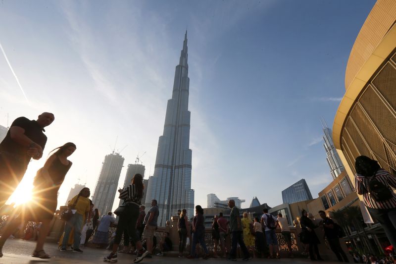 &copy; Reuters. People are seen in front of Burj Khalifa, the world tallest building, in Dubai
