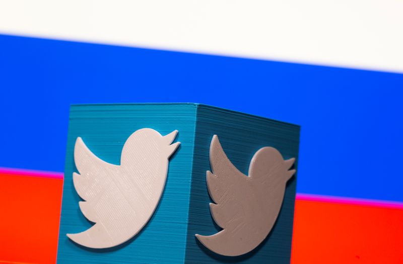 &copy; Reuters. A 3D-printed Twitter logo is pictured in front of a Russian flag in this illustration