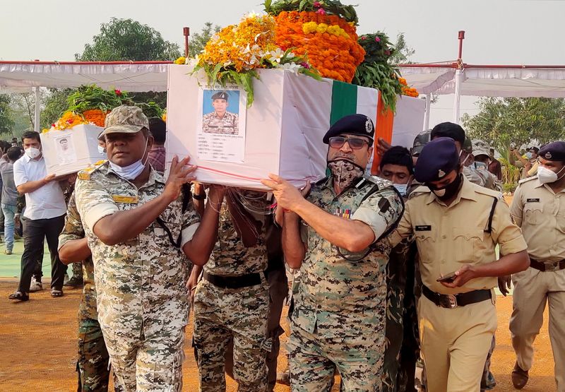 &copy; Reuters. Security forces officers carry the body of a colleague, who was killed in an attack by Maoist fighters, during a wreath laying ceremony in Bijapur