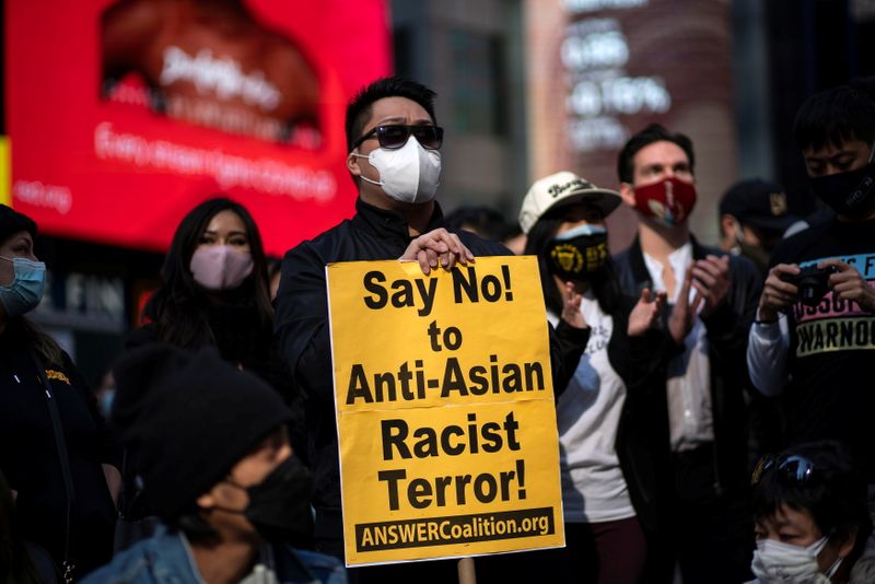 © Reuters. People attend the Stop Asian Hate rally at Times Square in New York