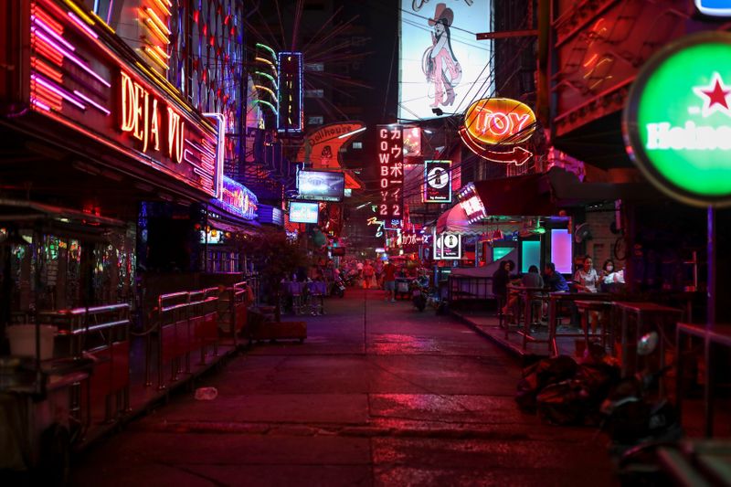 &copy; Reuters. Night clubs and go-go bars street Soi Cowboy is seen empty after Thai government ordered the closure of cinemas, bars and other entertainment facilities as part of a raft of measures intended to control the spread of the coronavirus outbreak in Bangkok