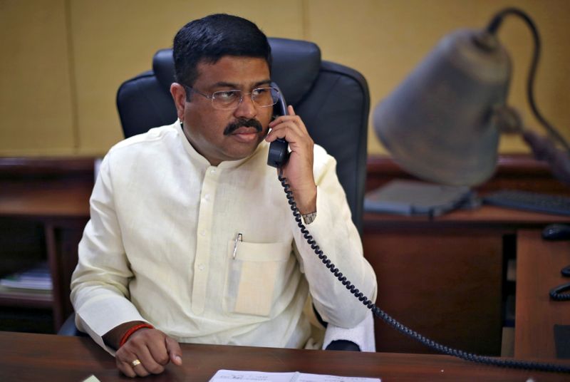 &copy; Reuters. FILE PHOTO: India&apos;s Oil Minister Pradhan speaks on phone during an interview with Reuters in New Delhi